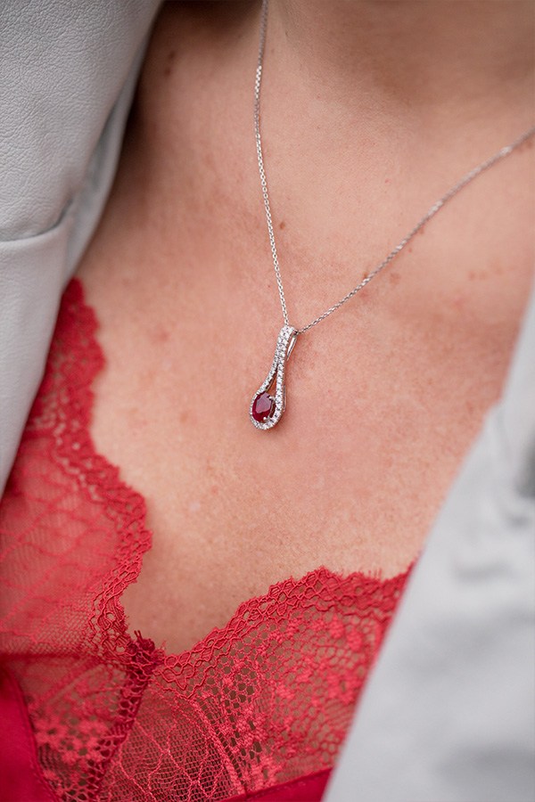 Jenny wearing Oval Ruby and Diamond Necklace in White Gold