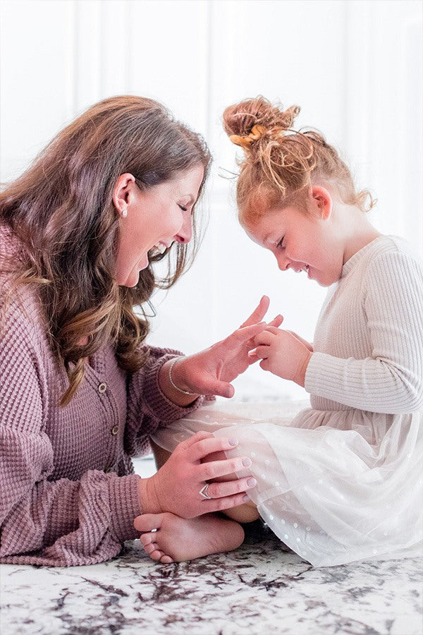 Jessica and Sunny looking at A. Jaffe Oval Diamond Eternity Ring in White Gold