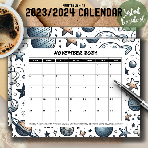 Galaxy theme November 2024 calendar print out on a wooden desk with coffee and pen along with it