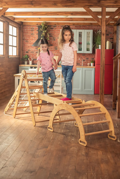 Two toddler girls playing in the house on a 4-in-1 Montessori Climbing Frame Set from a baby resale store