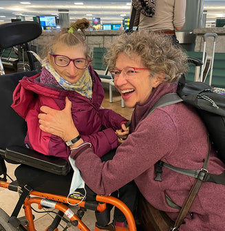 Alynne, delighted, as she reunites with her mother at the Vancouver airport - 2023