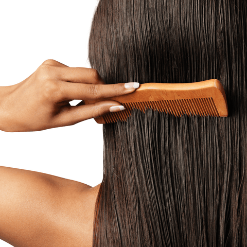 Use a Neem Comb to distribute oils through your hair