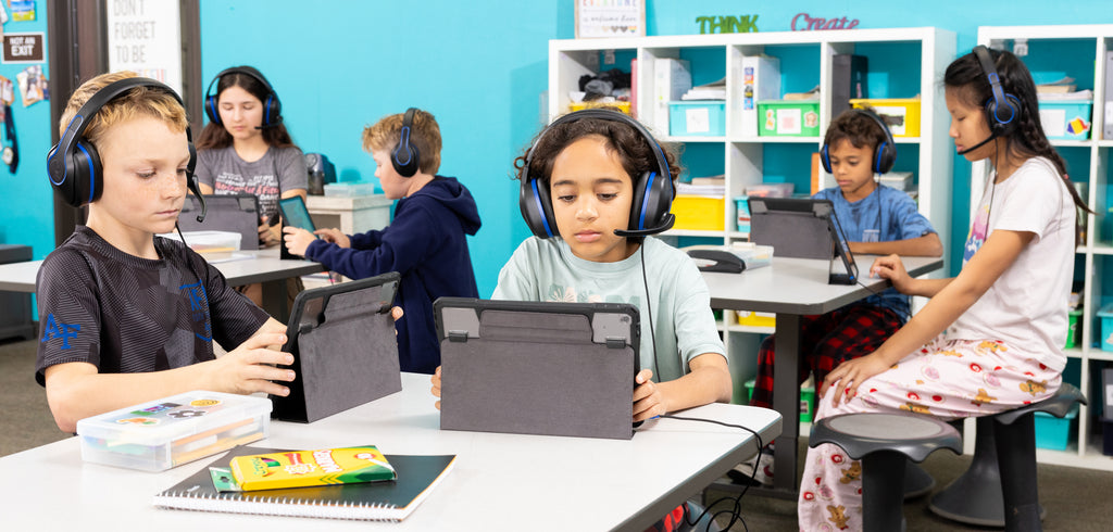 Students in a testing environment while wearing REVO headsets