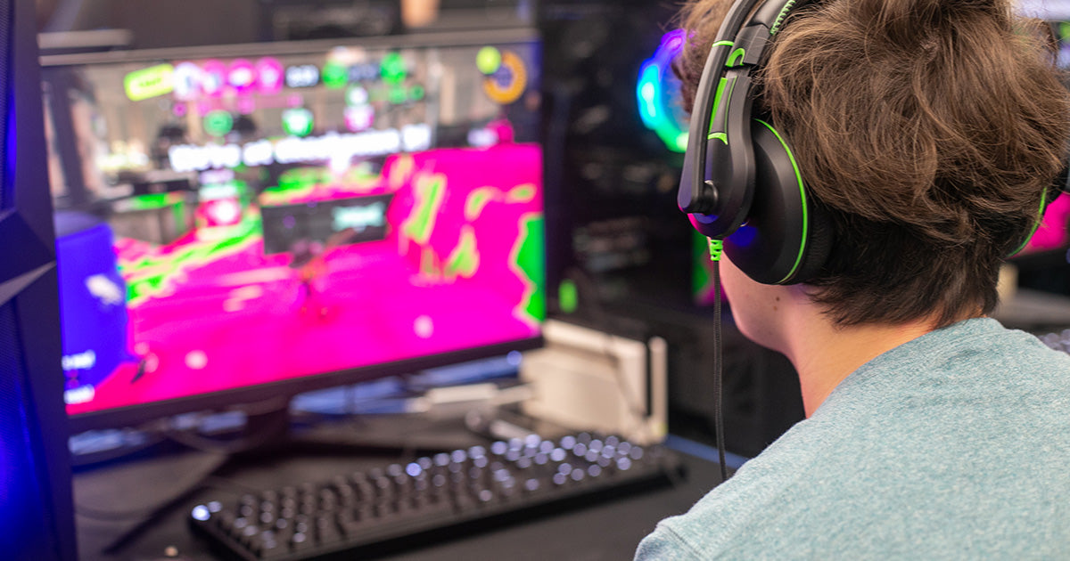 Rialto High School student enjoying immersive audio while PC gaming with the durable TWT Audio Victory 250XG gaming headset