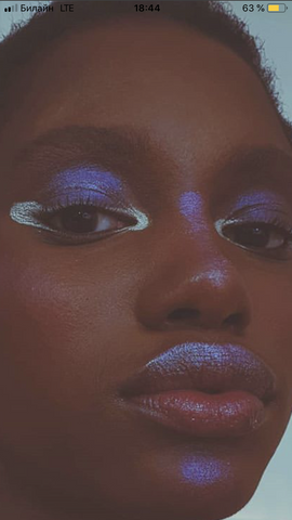 metallic lips, cosmic eyeshadow, alien model, futuristic makeup