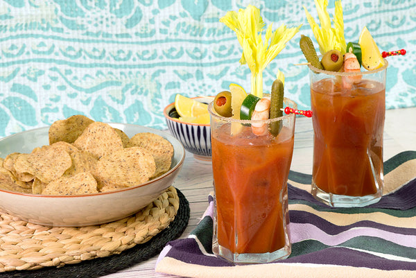 OVER THE TOP BLOODY MARY SERVED WITH GREEN LEMON & PINK PEPPER TORTILLA CHIPS