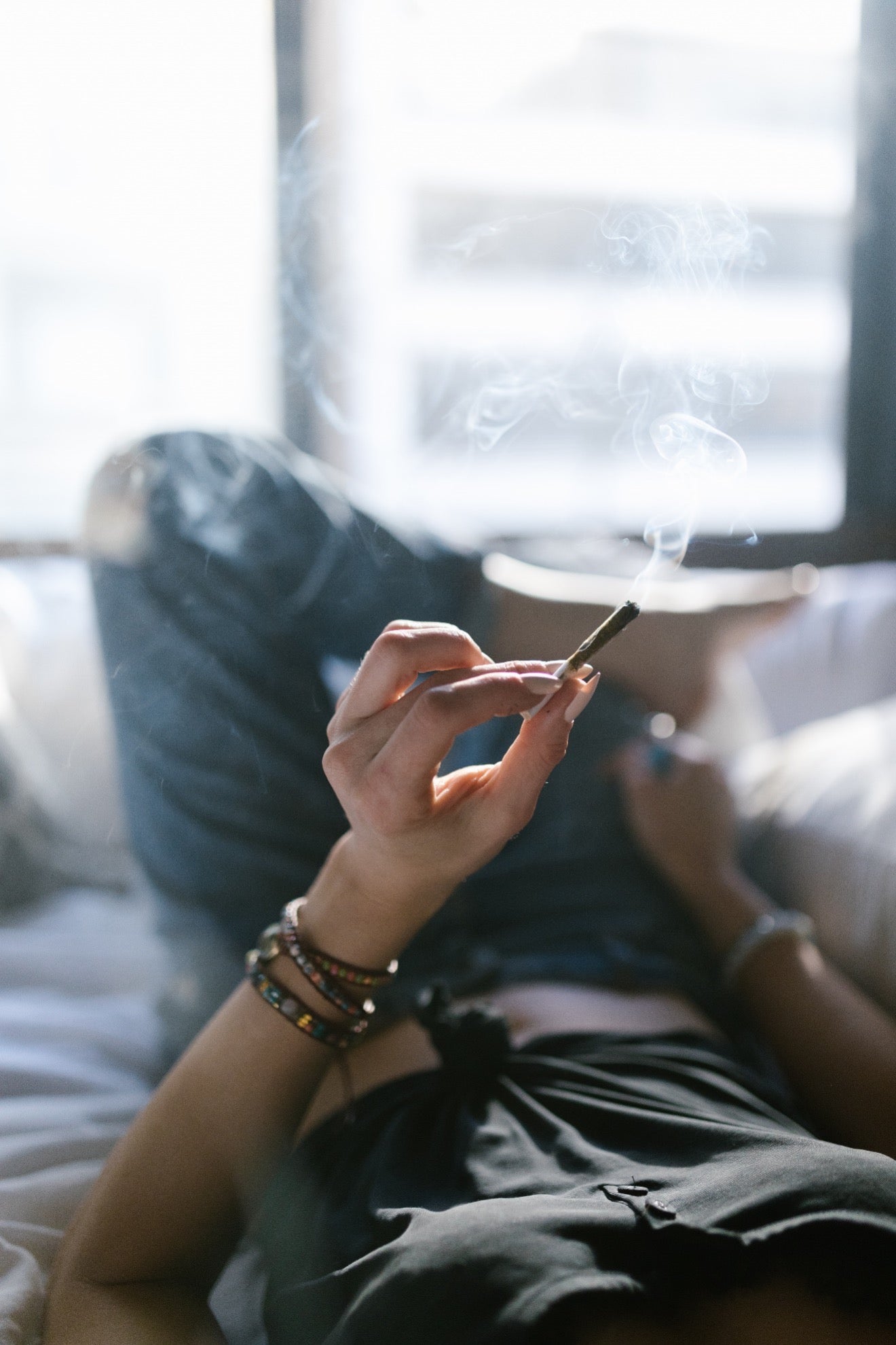 Girl holding a blunt