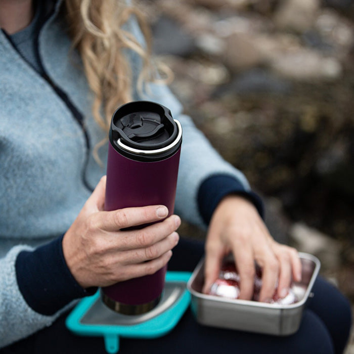 Klean steel bottle and mug on her trip