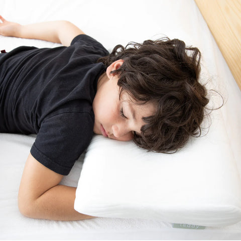 Boy sleeping on allergen pillow