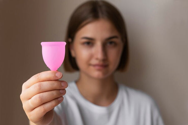 Women Holding Menstrual Cup
