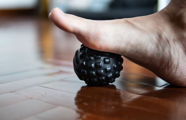 using a massage ball on feet for pain releif