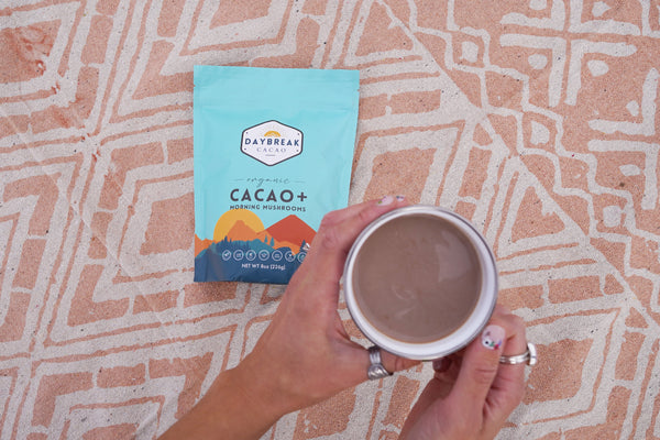 Daybreak Cacao in a mug on a rug