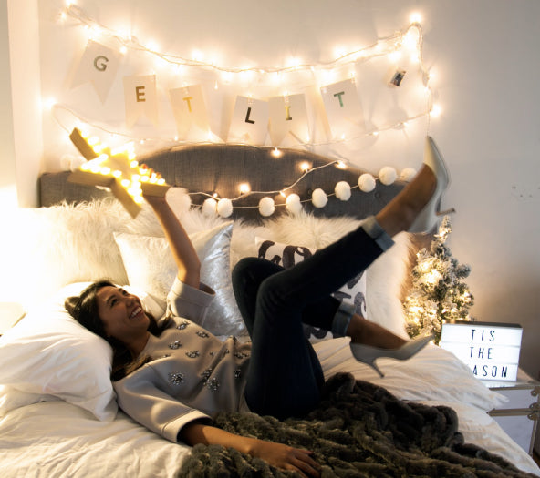 Cozy Dorm Room with String Lights from Dormify