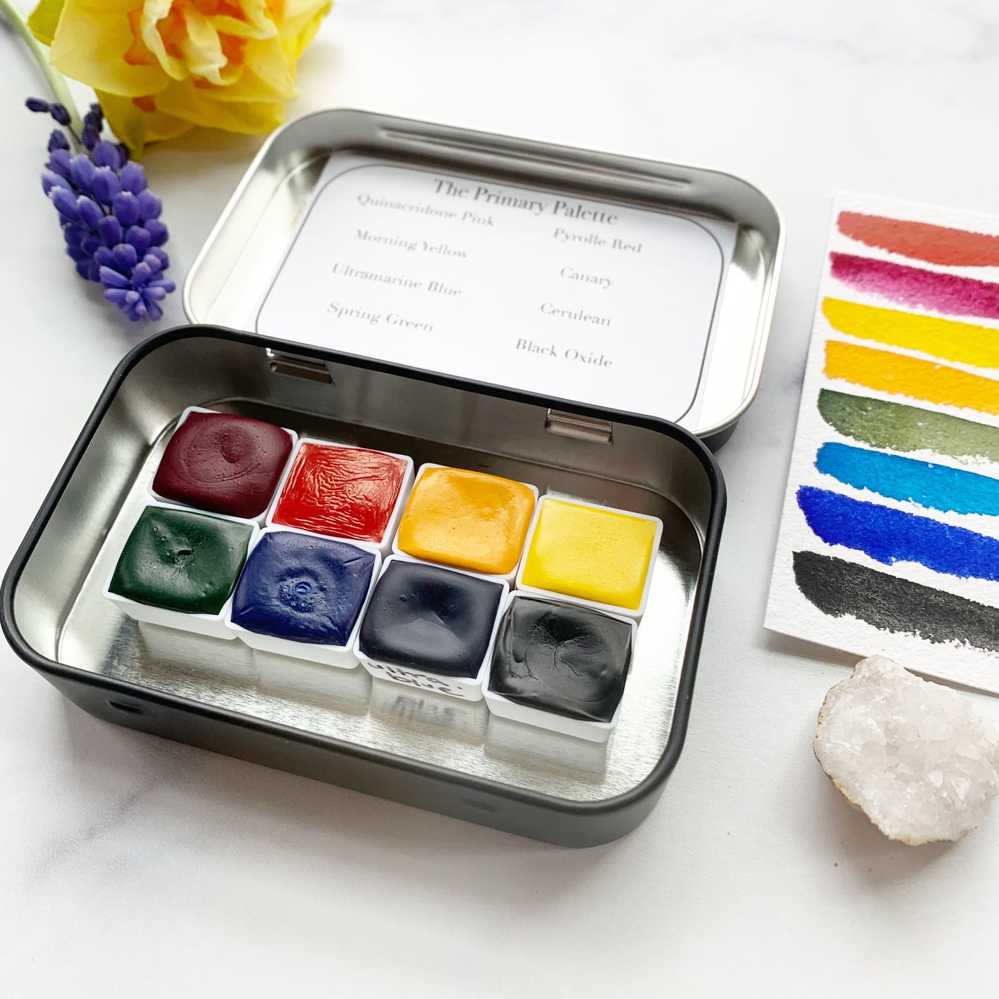 The Primary Palette, eight colors of handmade watercolor paint in a tin