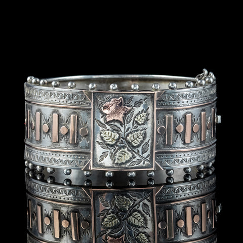 Antique silver cuff bangle with foliate details in multi-toned gold