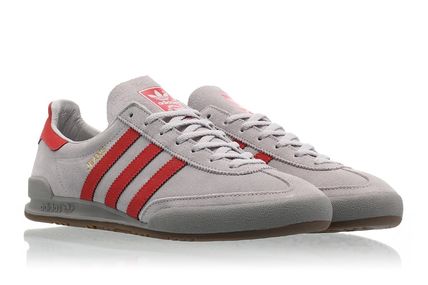 grey and red adidas jeans