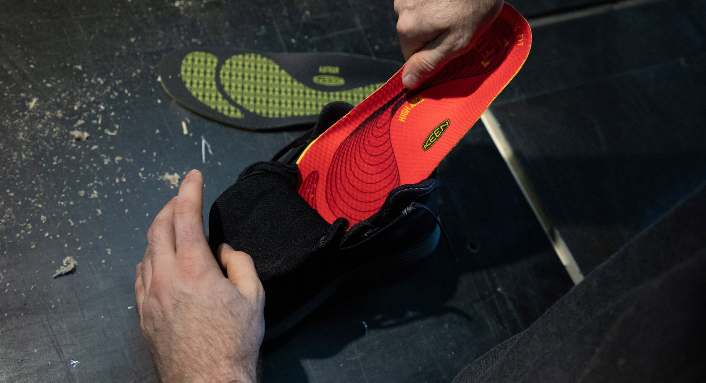 KEEN high arch insole being added to boot for additional support