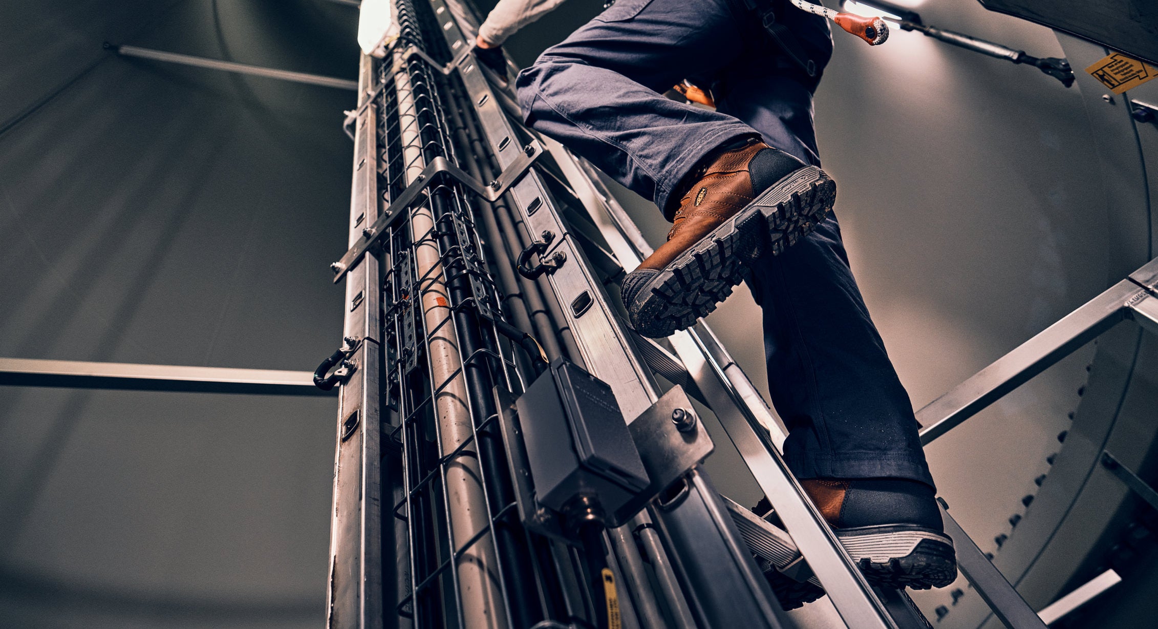 Man climbing ladder in Camden work boots with 90 degree heel