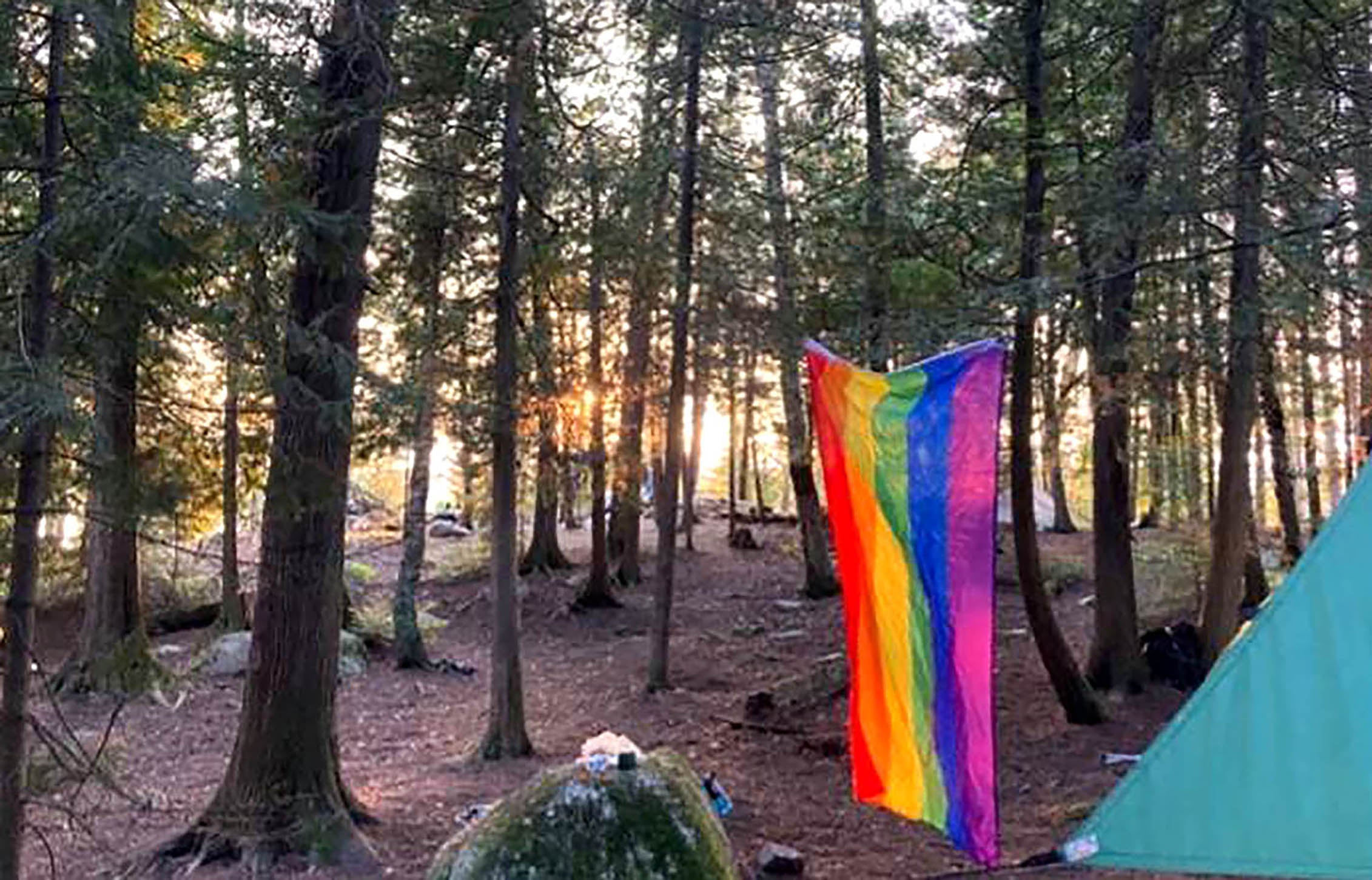 An LGBTQ+ flag in Boundary Waters Wilderness