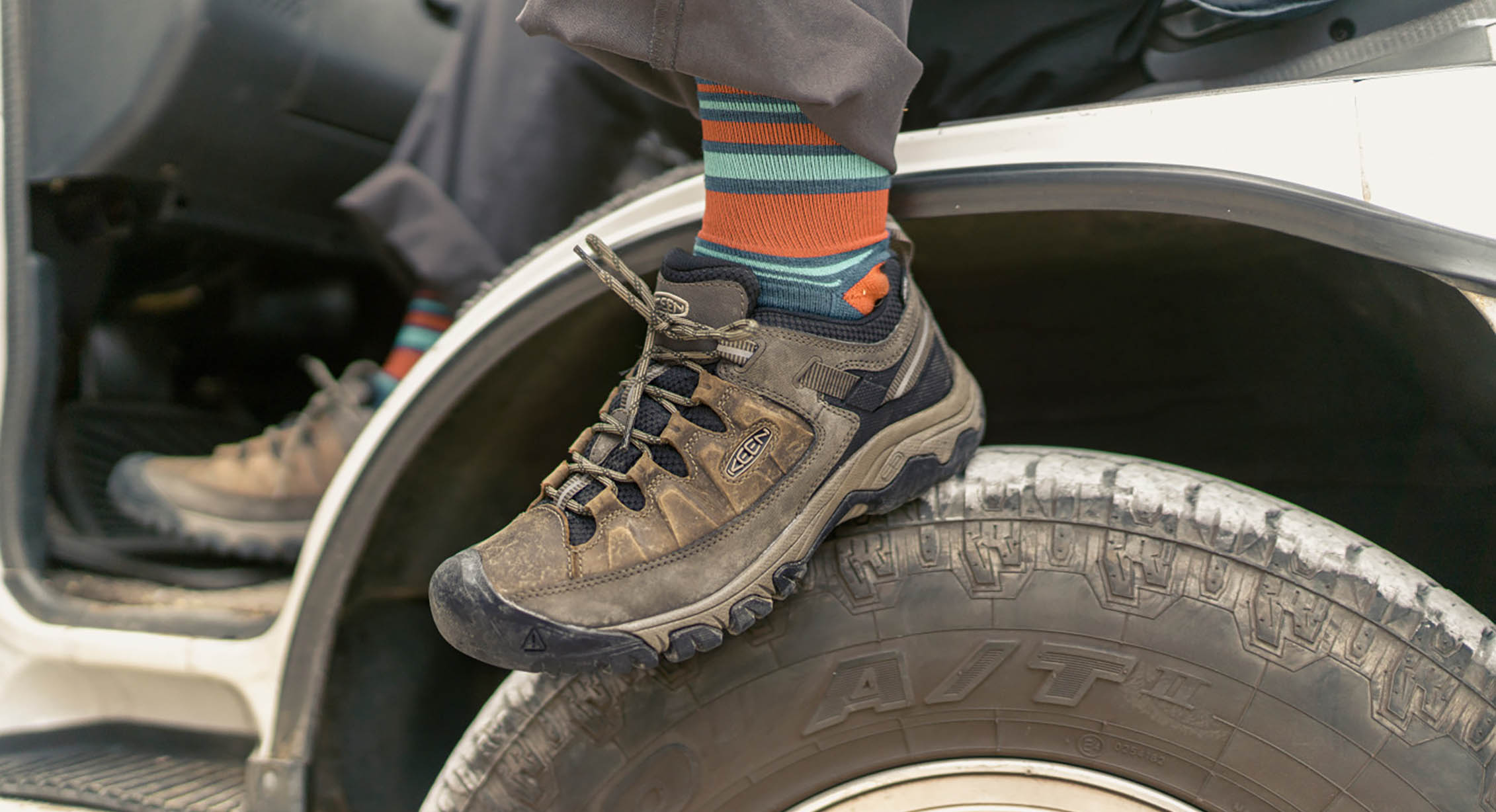 KEEN hiking shoes on a truck tire