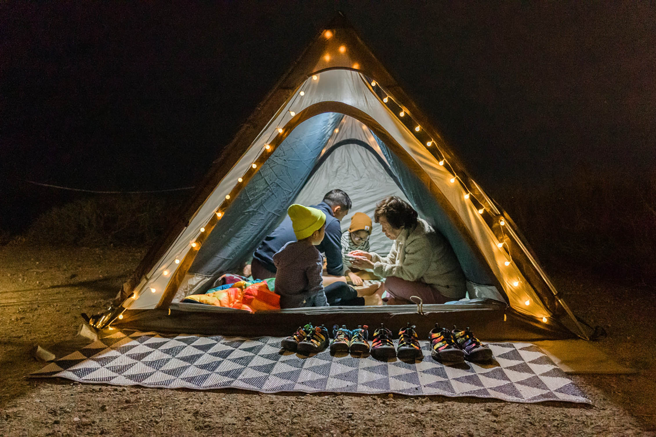 A family playing games in a tent