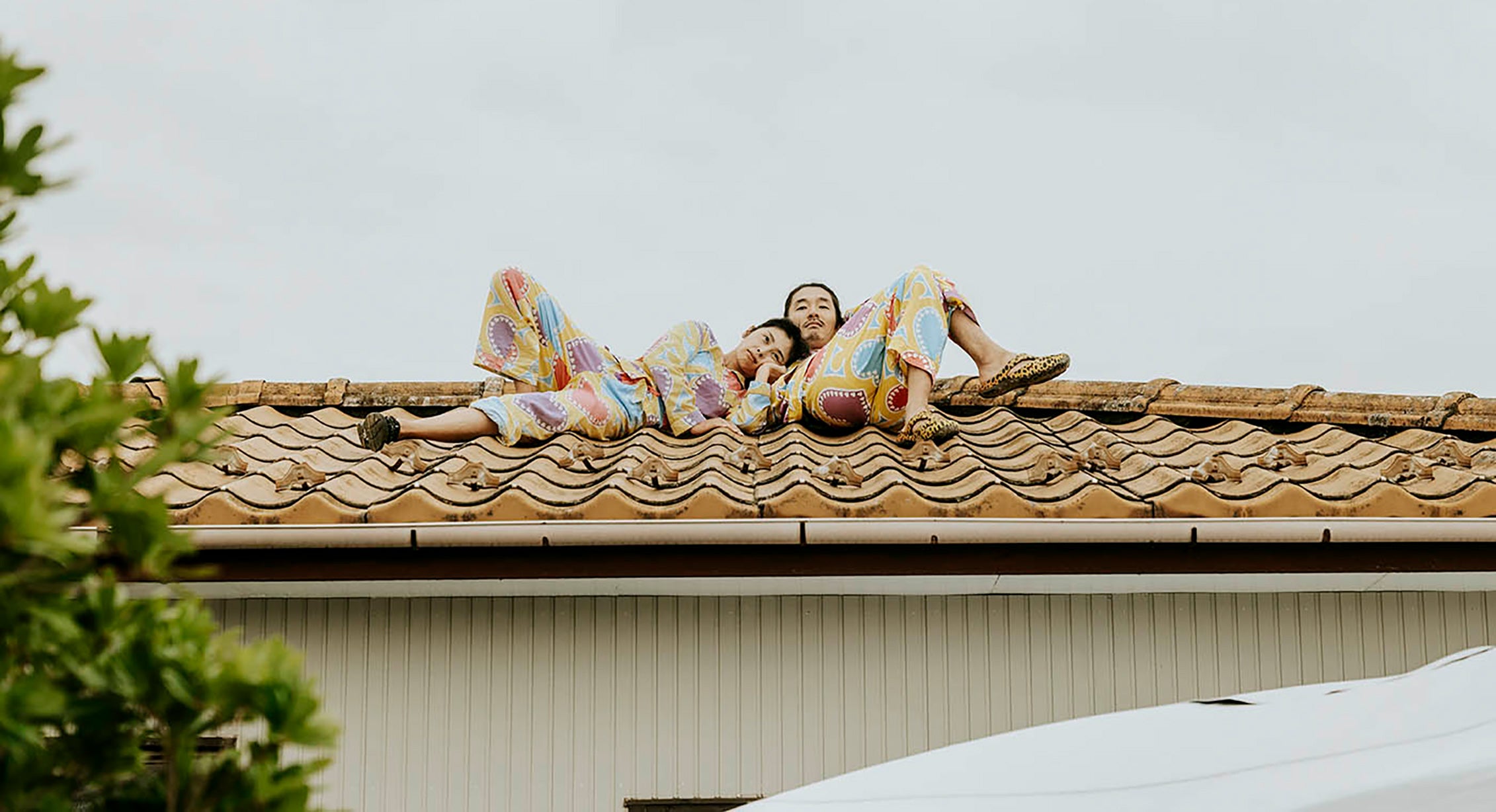 A couple relaxing on their roof in Japan