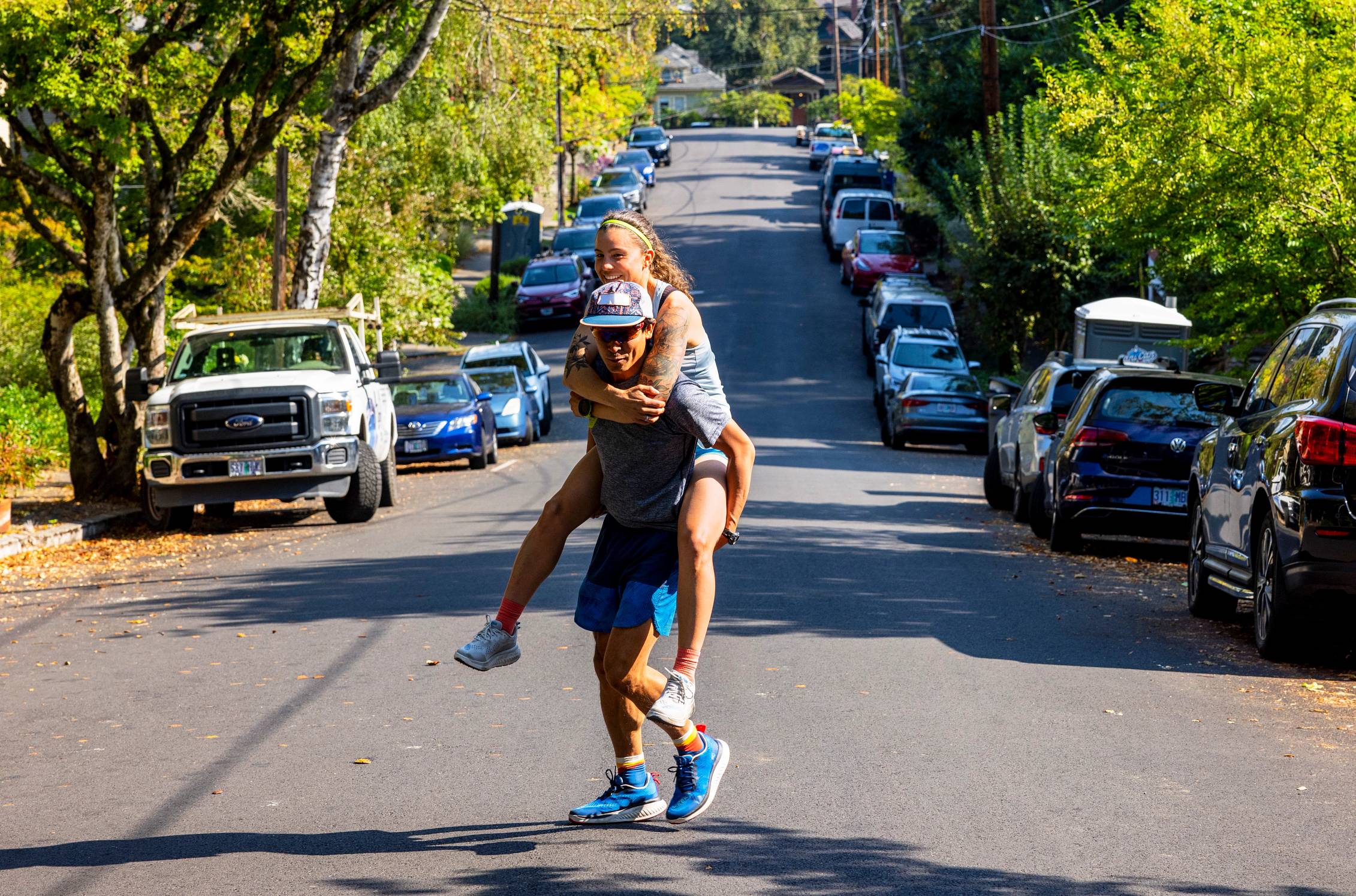An adult getting a piggyback ride while walking