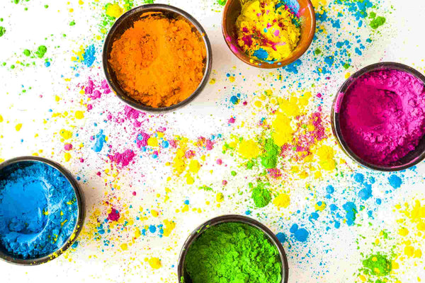 Blue, orange, yellow, green and pink gulal to celebrate Holi festival