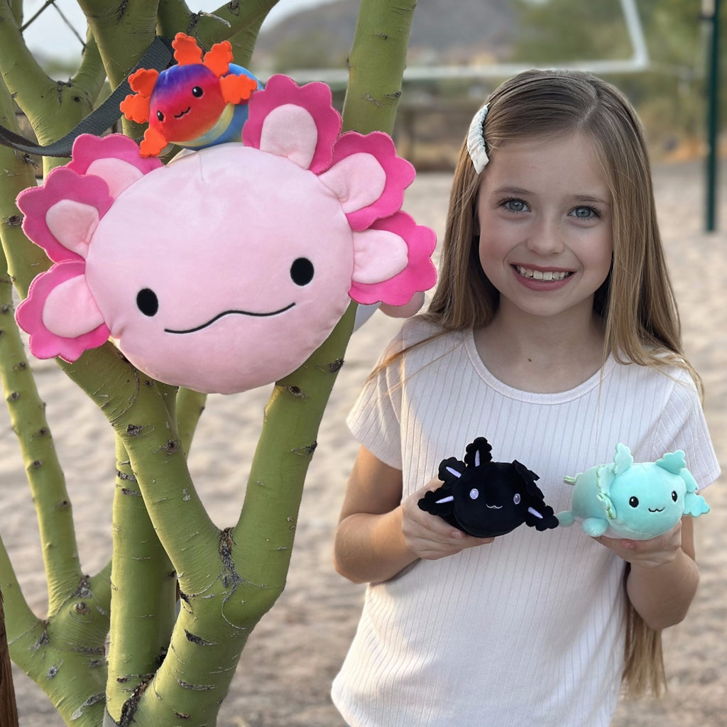 Have a look at this eye-catching set of axolotl plush toys. Guess what? It was a neat surprise! Unzip the plushie at the bottom to find three amazingly adorable mini baby axolotls. This makes it an awesome gift for anyone who loves axolotls or is just a big fan of stuffed toys.