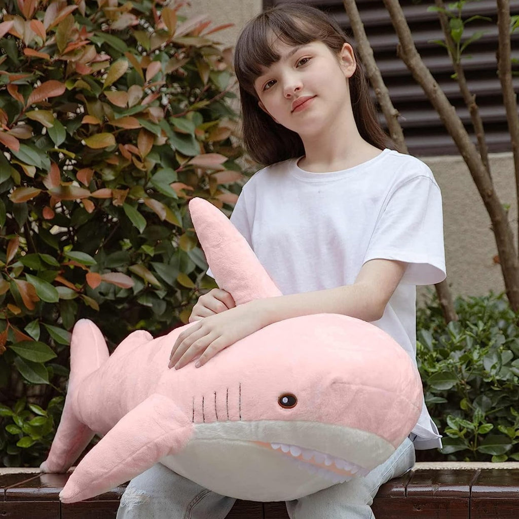 Looking for the perfect cuddle friend? Check out this Shark Plush Toy! It's not only super snug, but its lovely pink hue is sure to bring an adorable splash of color to your space. This plush toy is definitely a must-have for you!