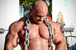 muscular man with chains around his neck