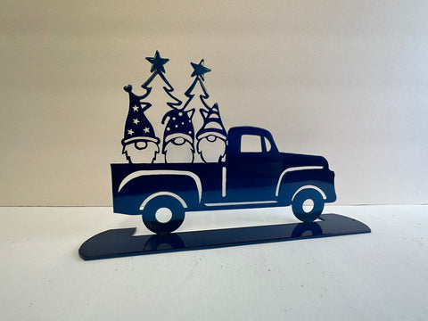 Metal art gnomes in a vintage pickup truck