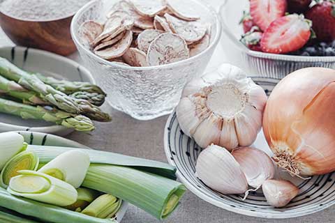 Prebiotic foods: onions, garlic, leeks, strawberries, asparagus