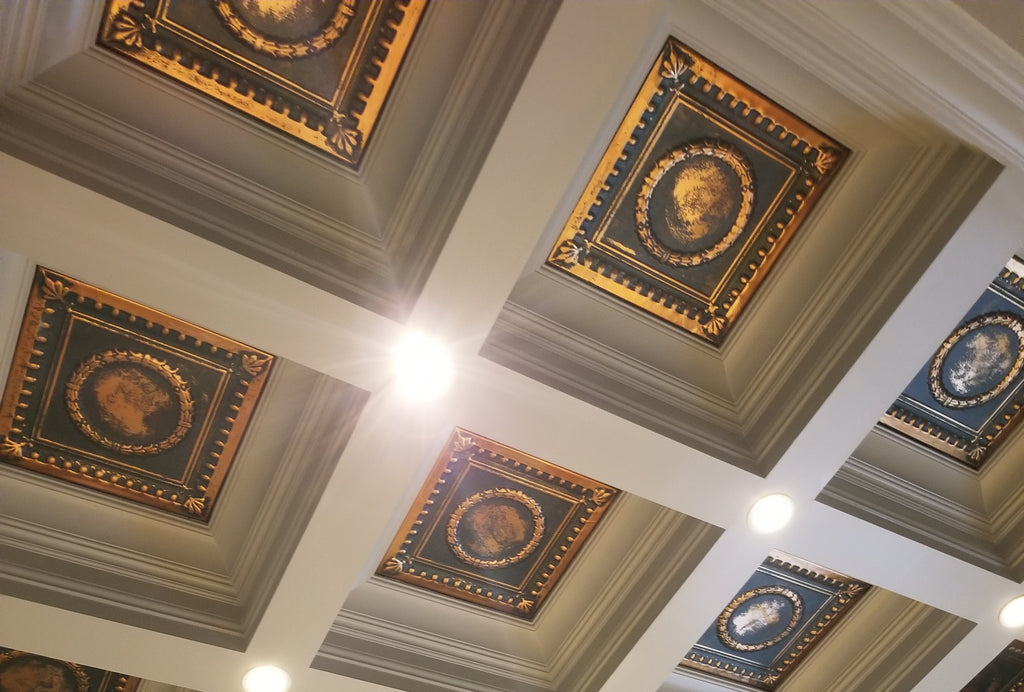 Installed tin tiles in a coffered ceiling.
