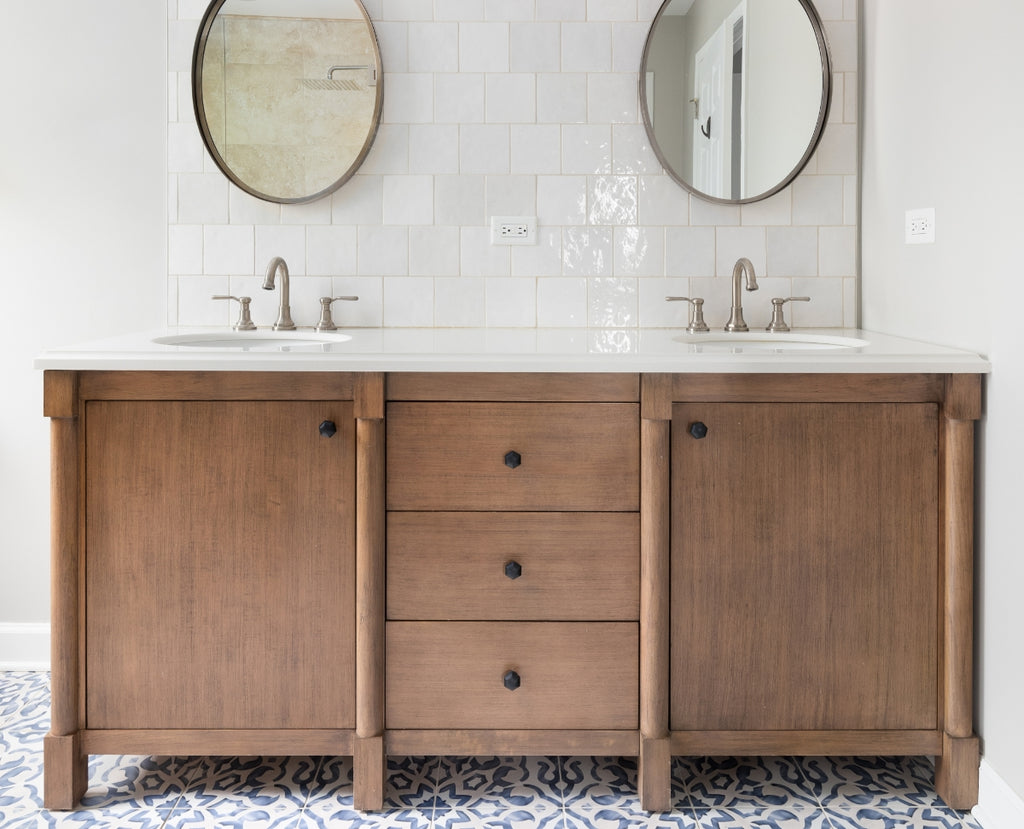 White bathroom with warm wood double vanity.