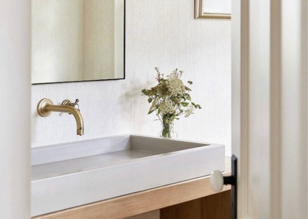 Farmhouse style bathroom with soft, pastel color palette.