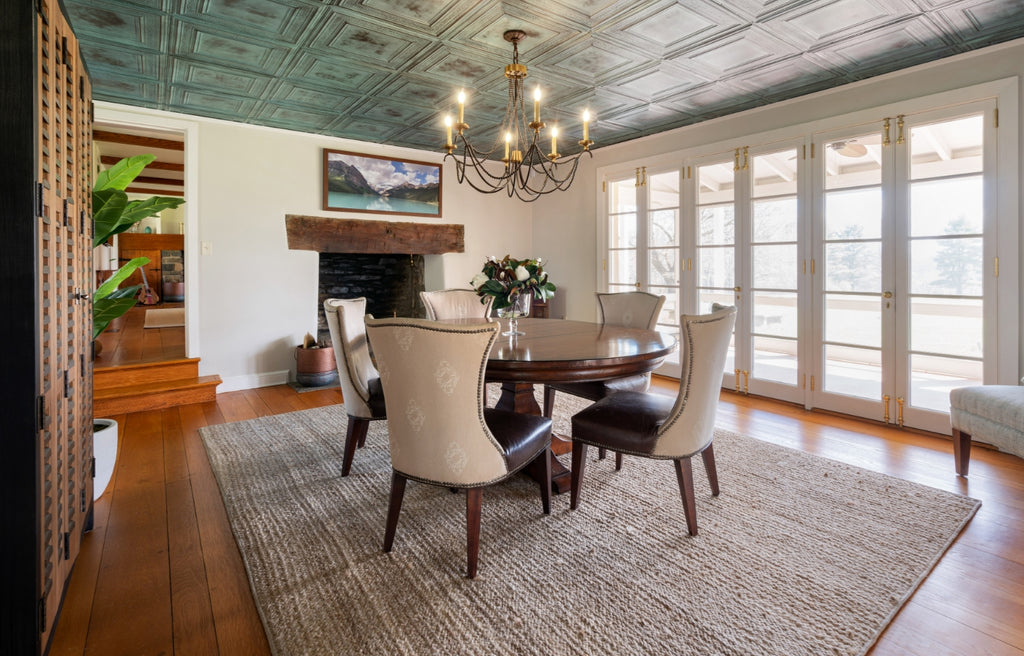 Large farmhouse style dining room with tin ceiling in silver.