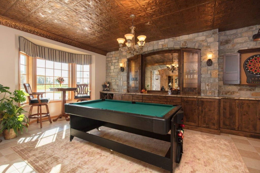 Large game room with tin tile ceiling in copper.