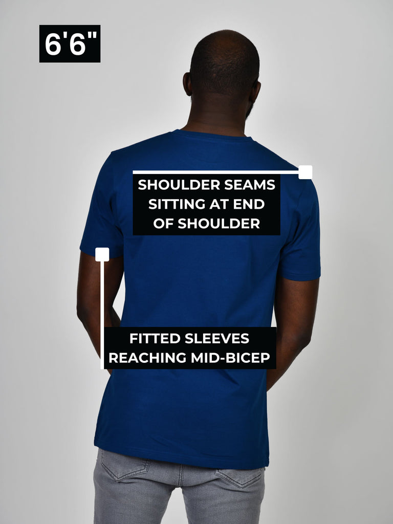 Tall t-shirt showing fitted shoulder seams and fitted sleeves reaching mid bicep