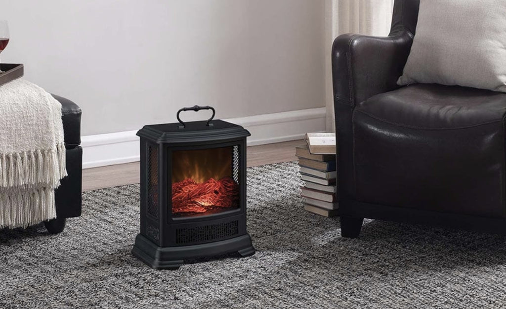 Small space heater that looks like a miniature wood-burning fireplace in a living room.