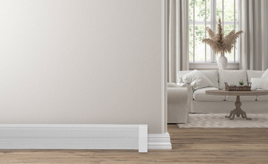 White and neutral colored living room with white baseboard heater covers.