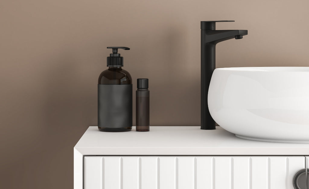 Bathroom vanity with black faucet and white vessel sink.