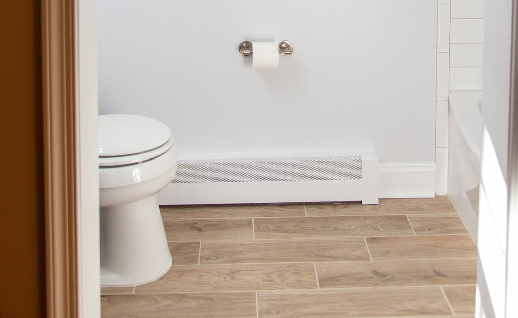 Steel baseboard heater in a bathroom.