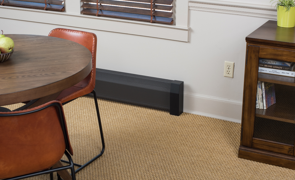 Small space at home with white walls and contrasting black baseboard heaters.