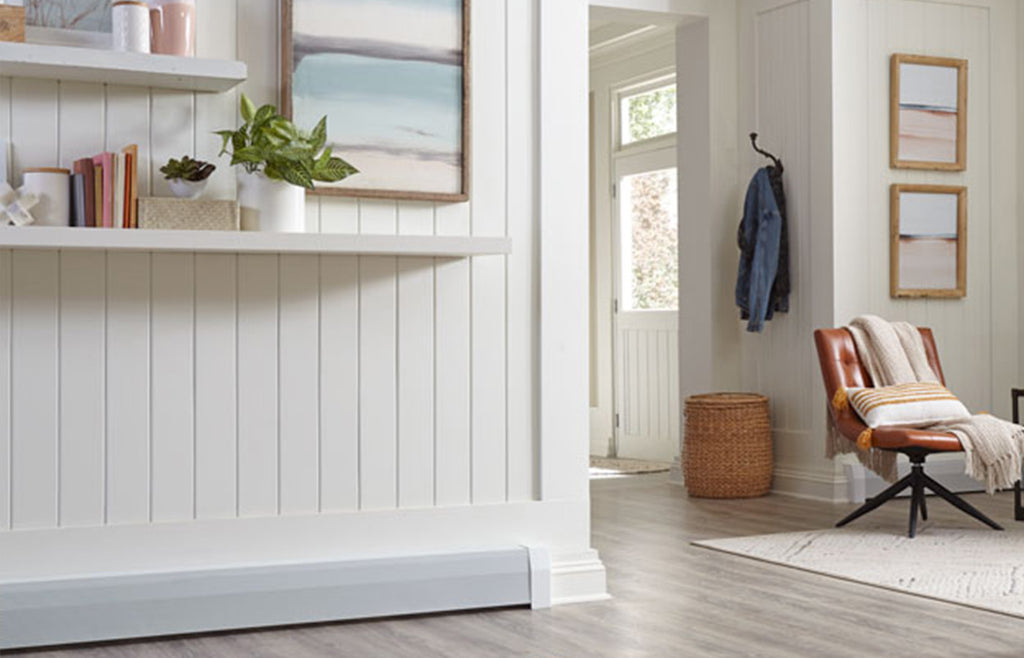 Hallway with white paneling and shelves with white baseboard heater cover on the wall.