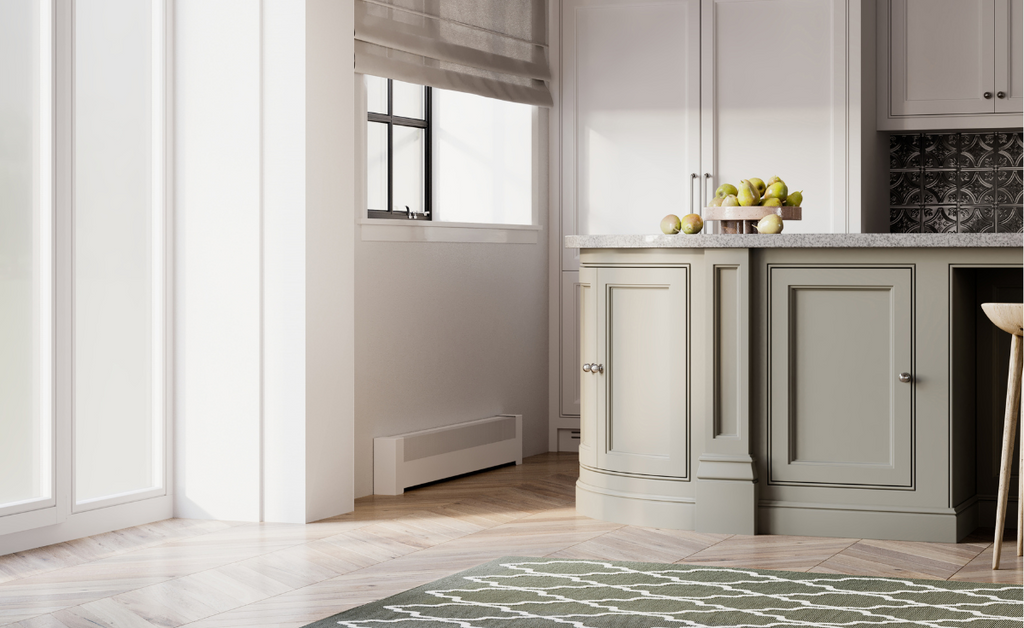 Green and white kitchen with white baseboard heater under a window.
