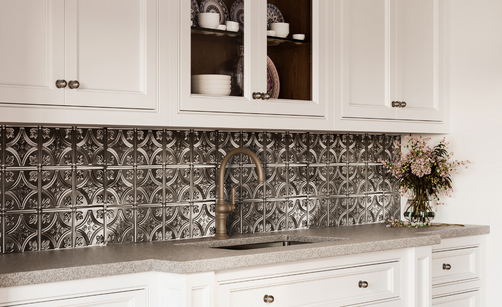 White kitchen with silver tin tile backsplash.