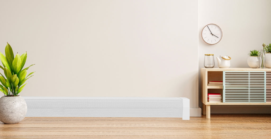 White living room with white hydronic baseboard heater.