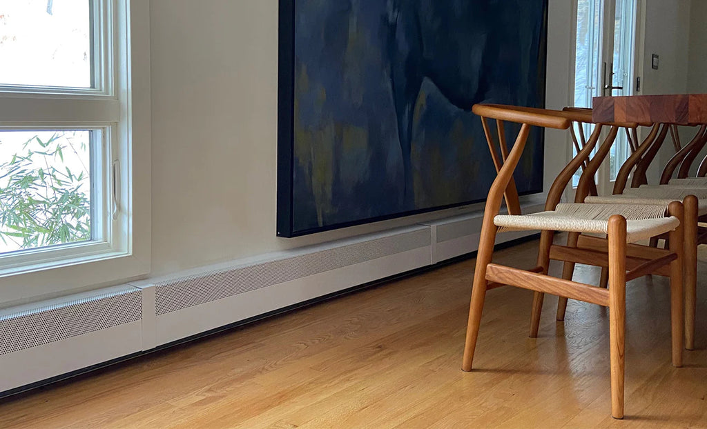 Dining room with modern styling and white baseboard heater.