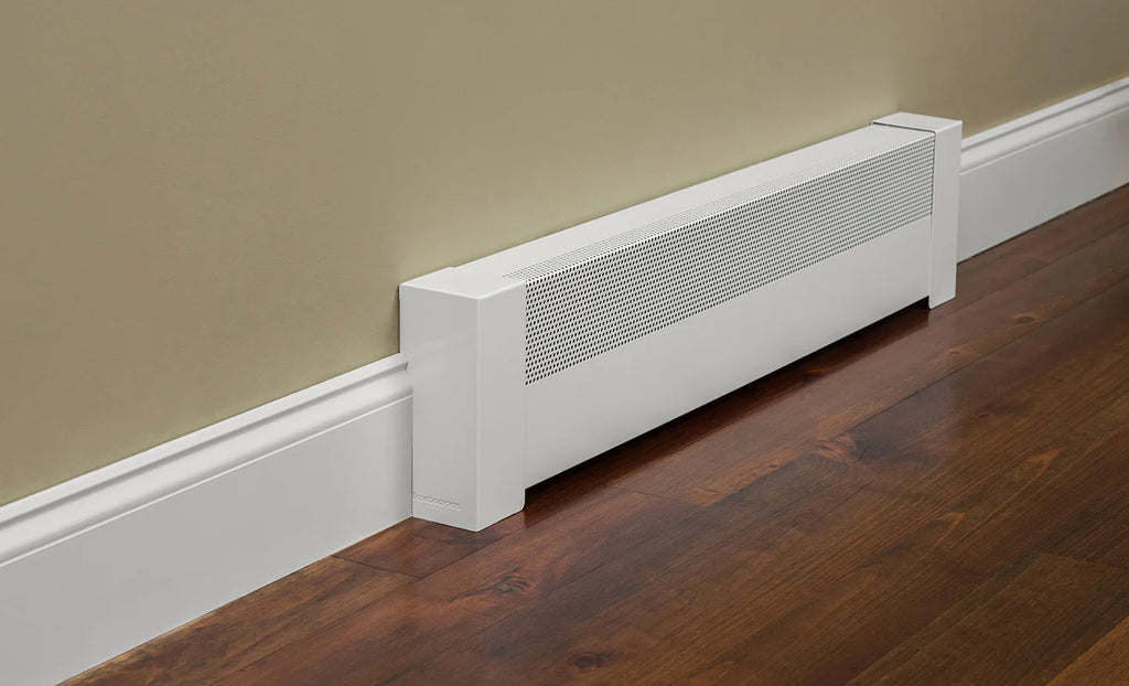White baseboard heater cover blends in with tall white baseboard trim against a beige wall.